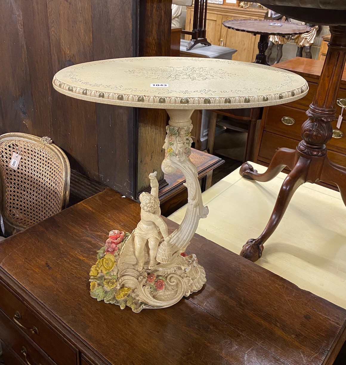 A 1950's Italian composite occasional table with figural cornucopia stem, width 49cm, depth 35cm, height 50cm